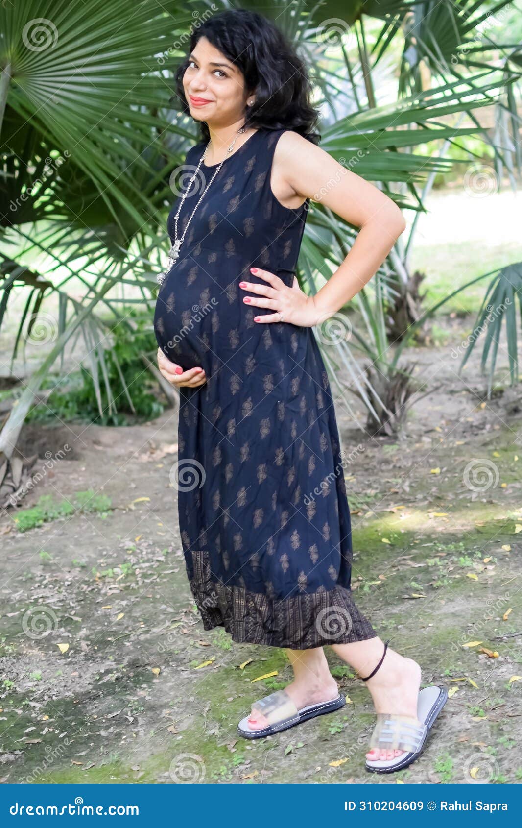 A Pregnant Indian Lady Poses for Outdoor Pregnancy Shoot and Hands on  Belly, Indian Pregnant Woman Puts Her Hand on Her Stomach Stock Image -  Image of caucasian, happiness: 310204609