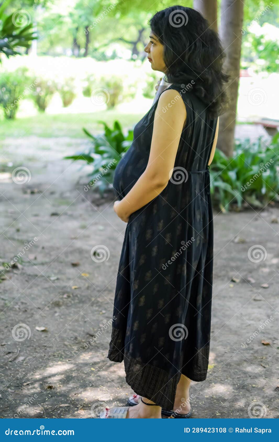 A Pregnant Indian Lady Poses For Outdoor Pregnancy Shoot And Hands On Belly Indian Pregnant