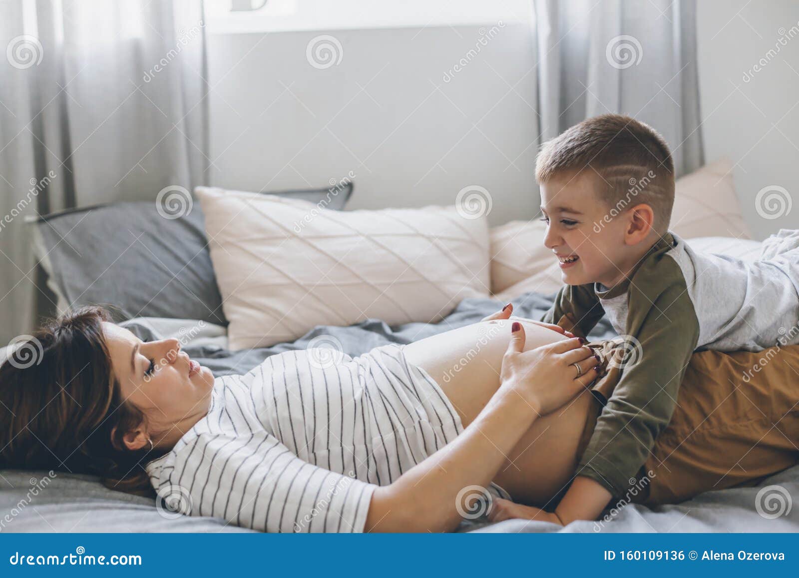 Mom And Son Share Bed Pregnant Mom Playing with Child in Bedroom Stock Photo - Image of pregnant,  morning: 160109136