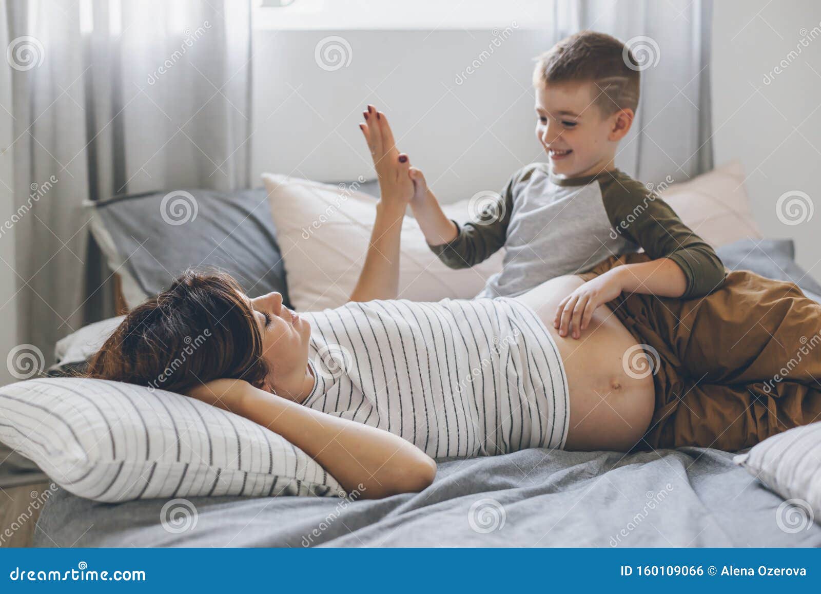 Mom And Son Share Bed Pregnant Mom Playing with Child in Bedroom Stock Photo - Image of maternity, morning: 160109066