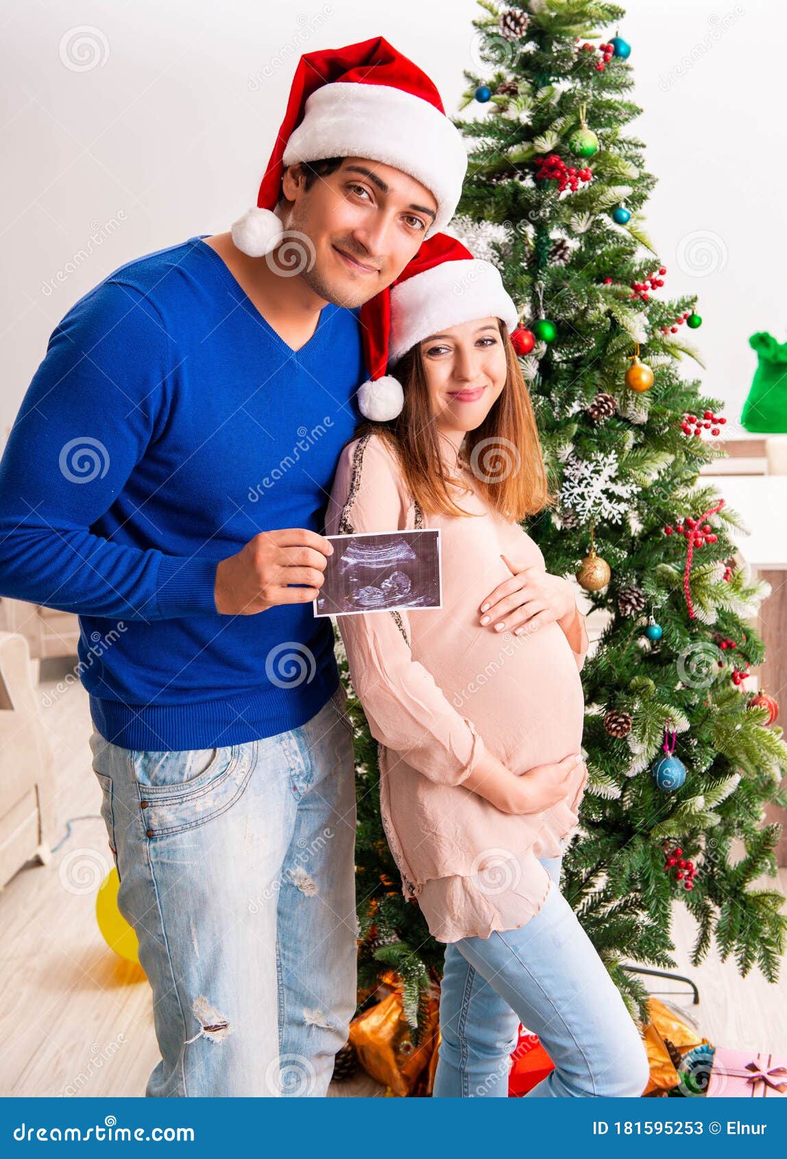 pregnant wife celevrating christmas with husband