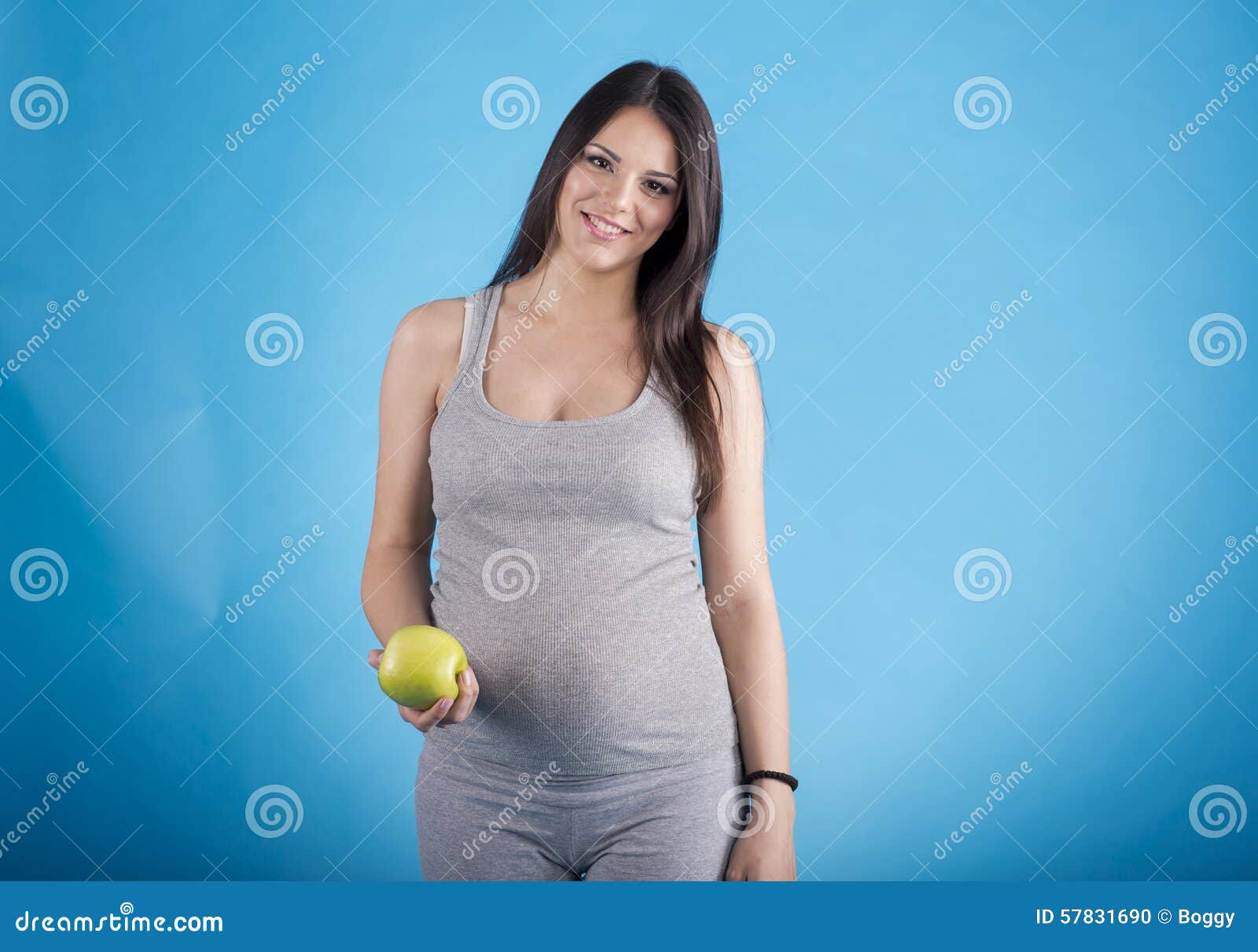 Pregnant Woman with the Apple Stock Photo Image of motherhood, care