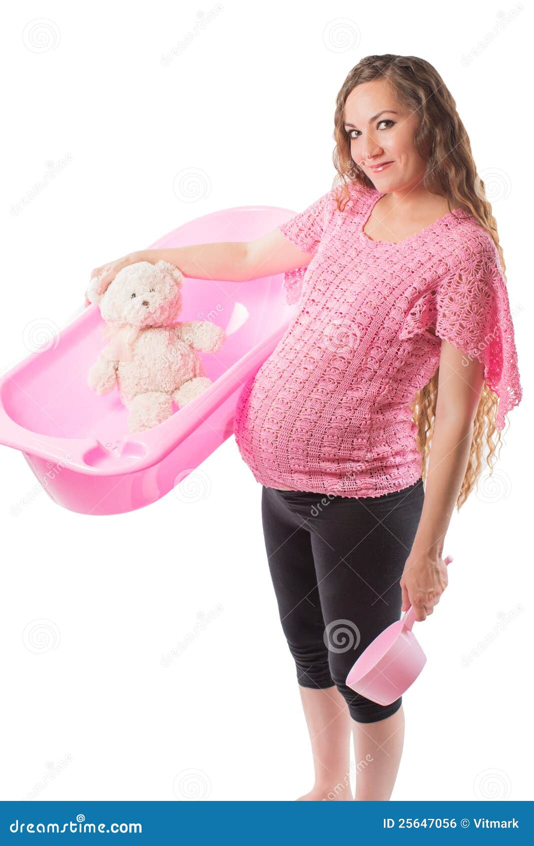 pregnant woman bathe with toy teddy bear in tub