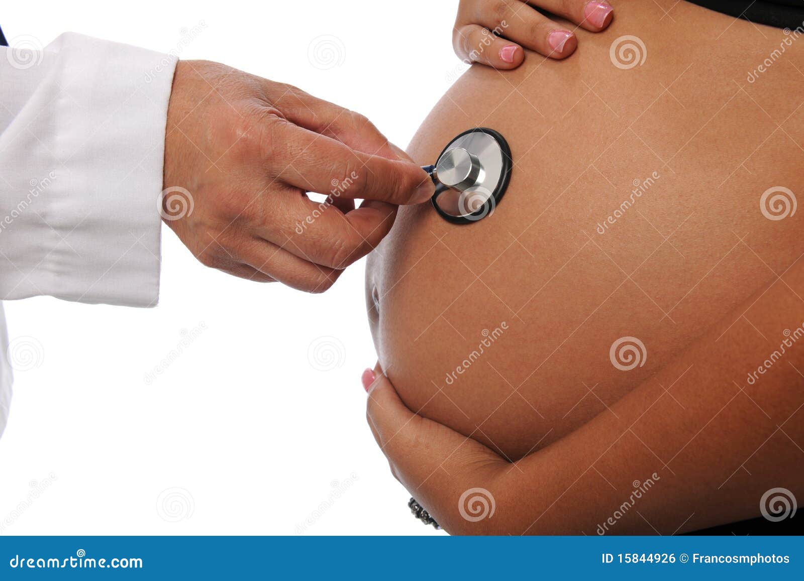 pregnant woman being examine by a doctor