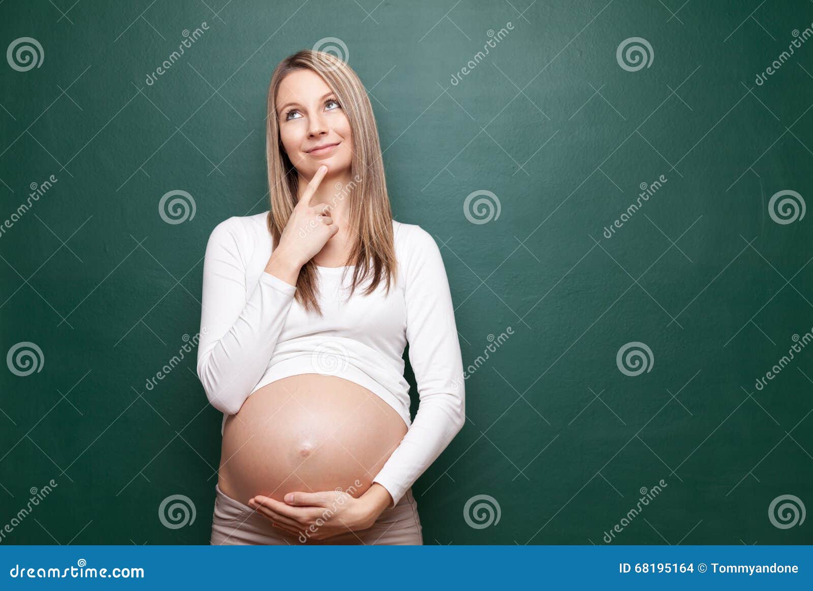 pregnant woman and a blackboard with copyspace