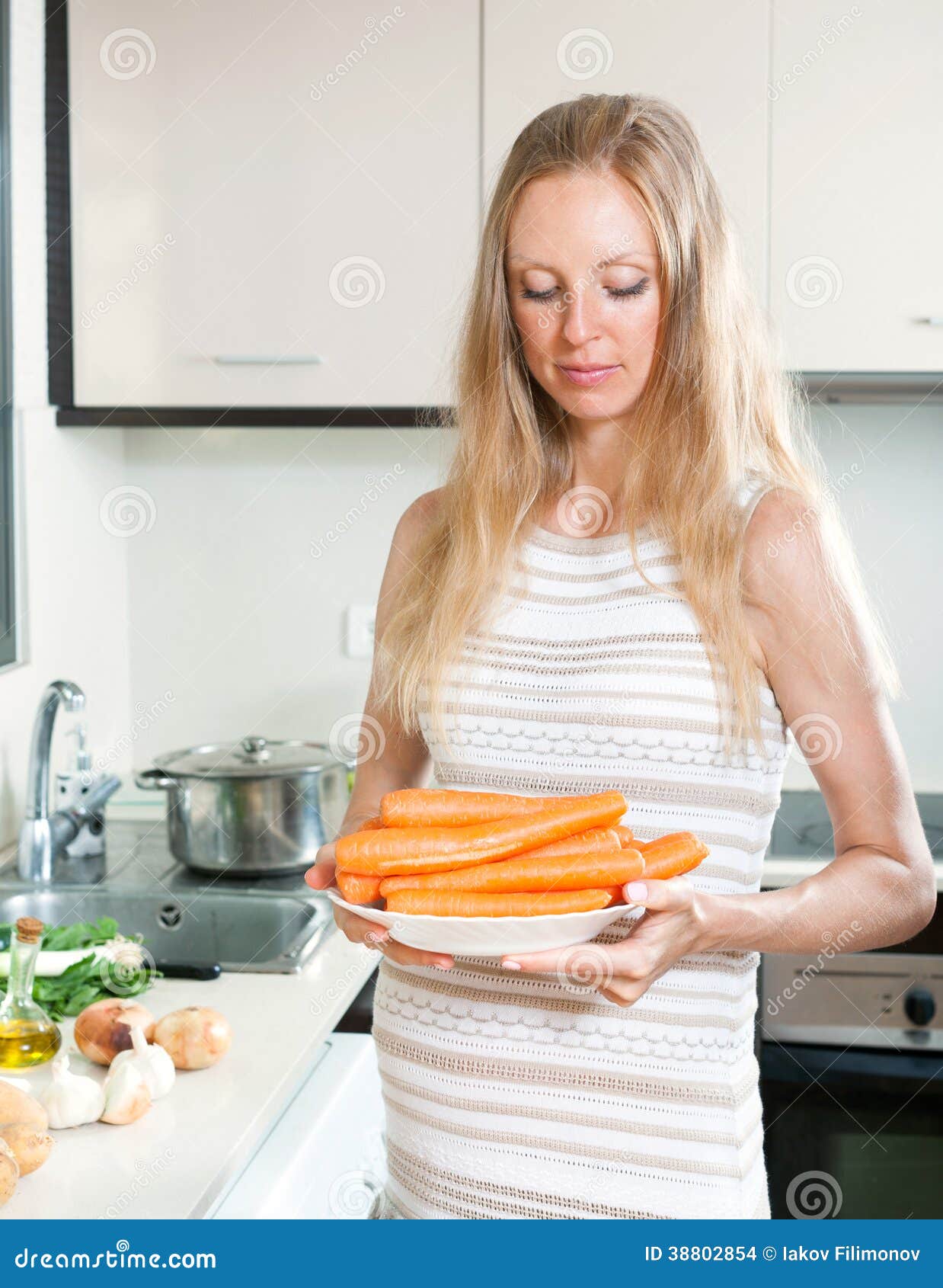 Pregnant Woman with Carrots Stock Photo Image of adult, breakfast
