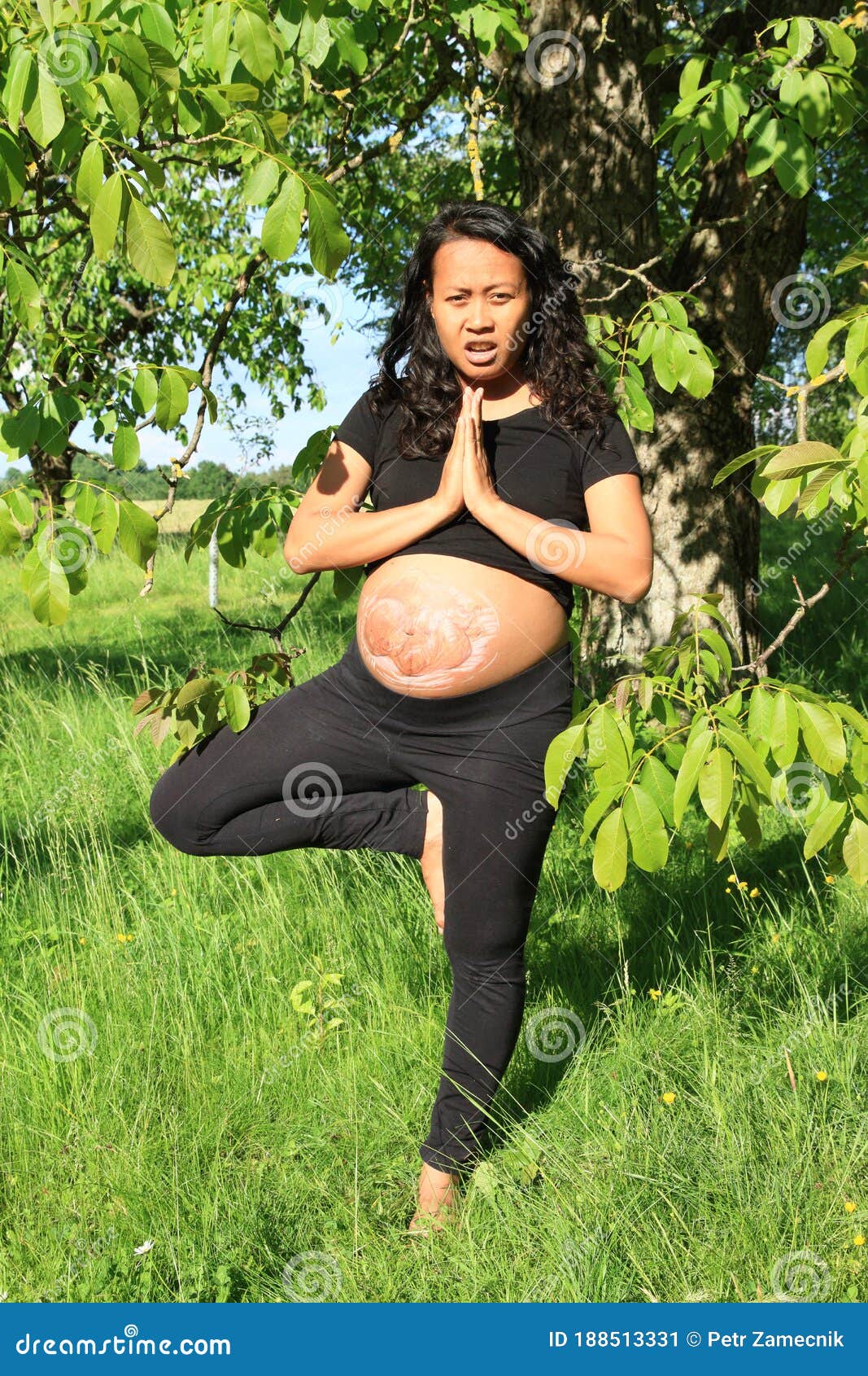 Pregnant Woman with Drawn Baby Exercising Yoga Stock Image - Image