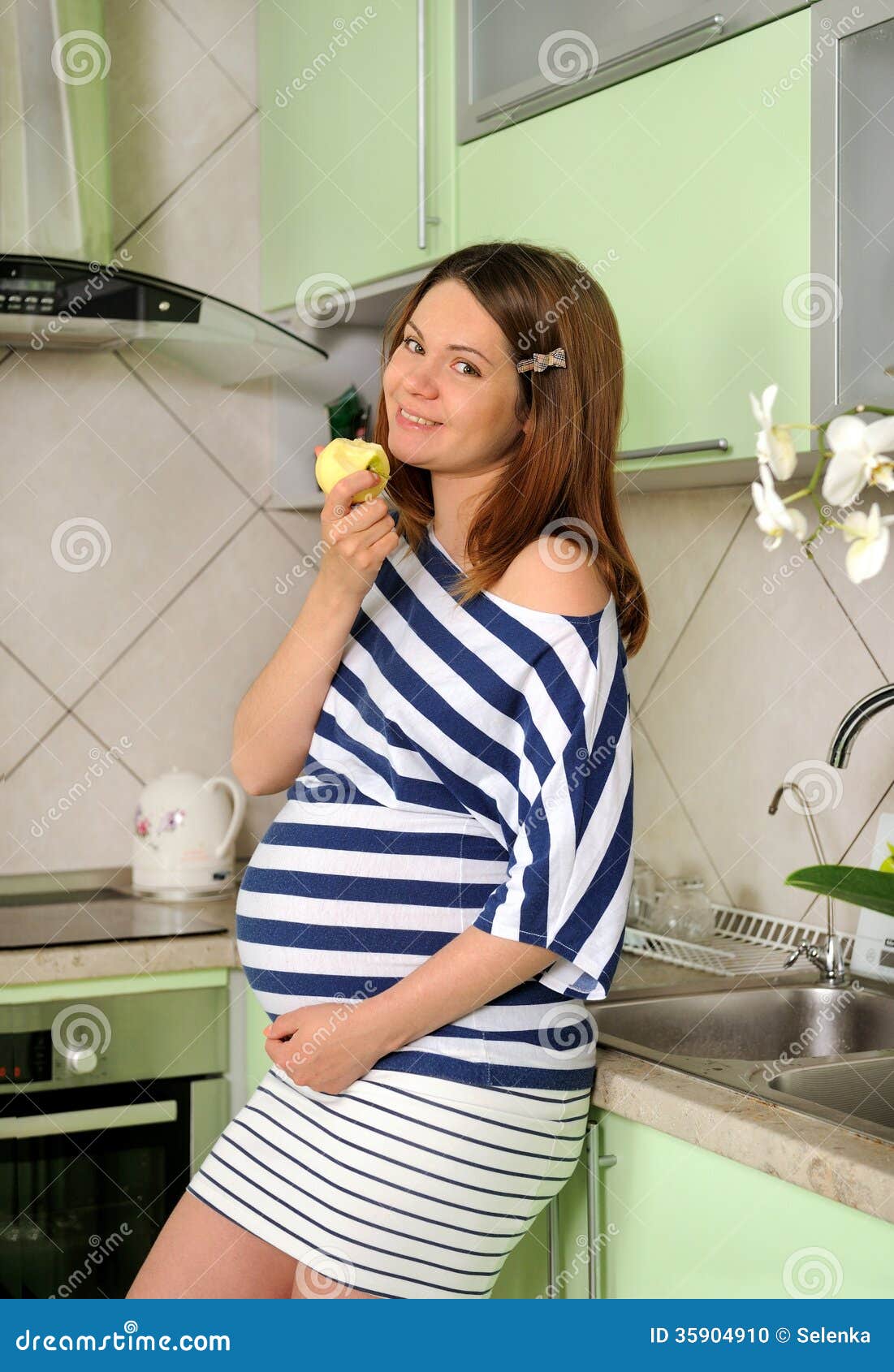 Pregnant Woman Eat the Apple. Stock Photo Image of dinner, mother