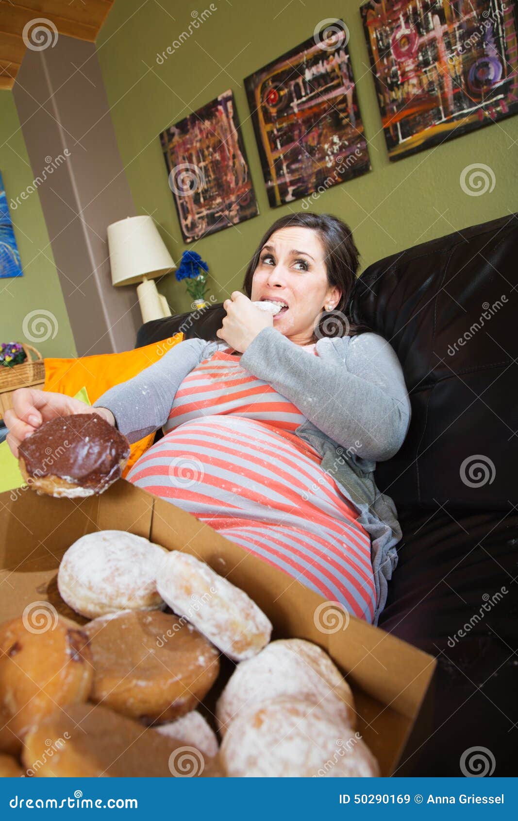 Pregnant Woman Eating Donuts Stock Photo - Image: 50290169