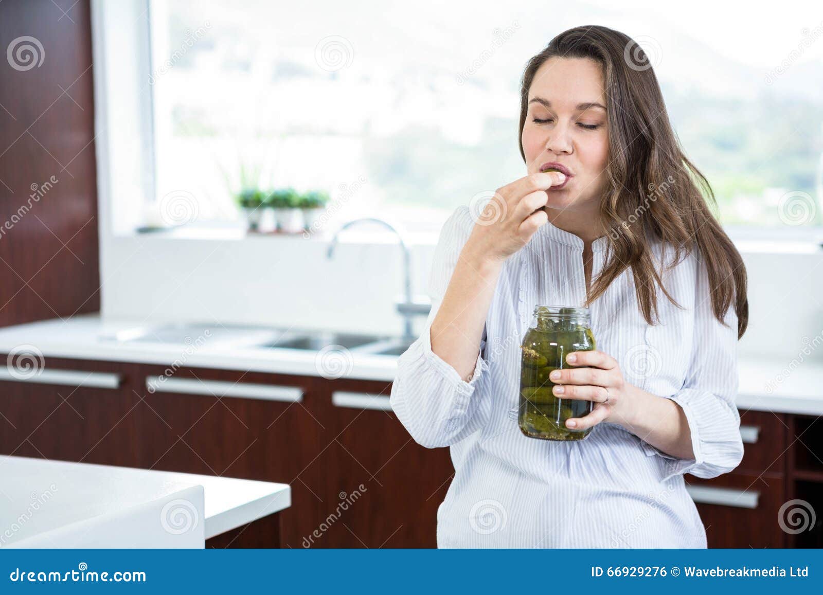 Pregnant Woman Eating Pickles Stock Photo Image of apartment, female