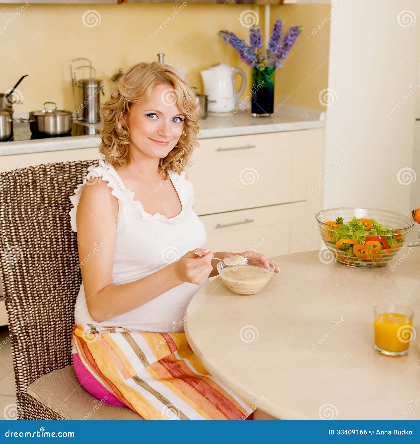 Pregnant woman eats soup stock photo. Image of spoon 33409166