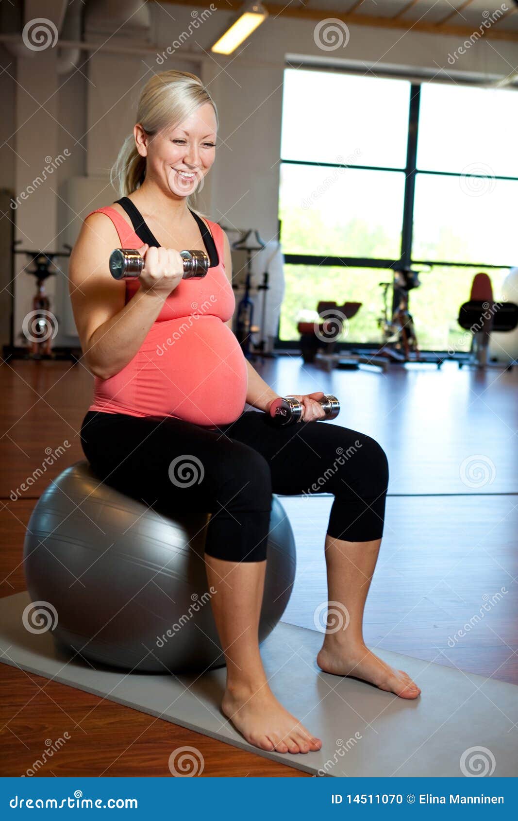 Pregnant Woman Exercising with Weights Stock Photo Image of sitting