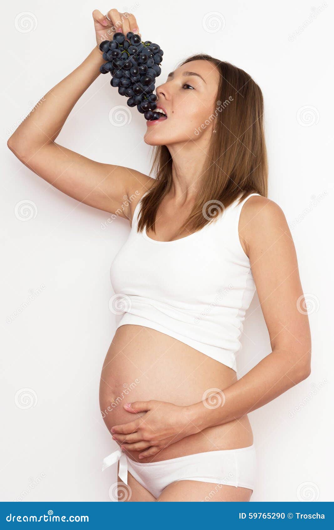 Pregnant woman with grape stock photo. Image of femininity 59765290