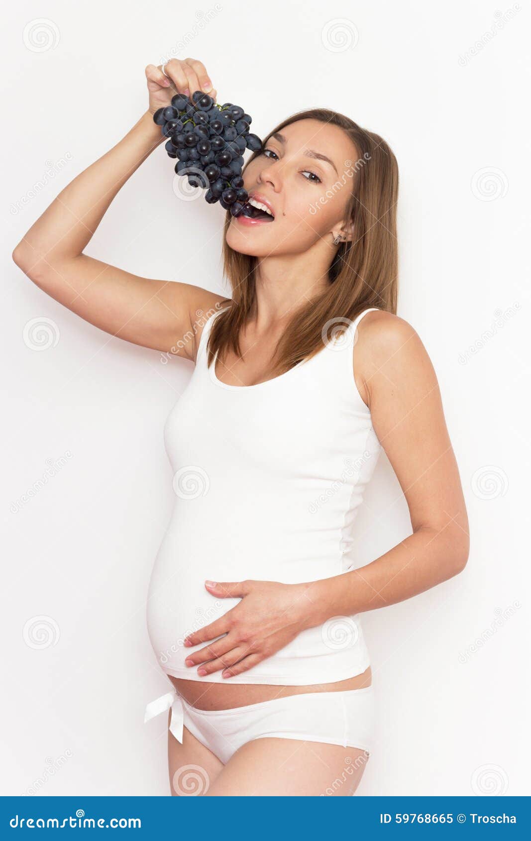 Pregnant woman with grape stock image. Image of cute 59768665
