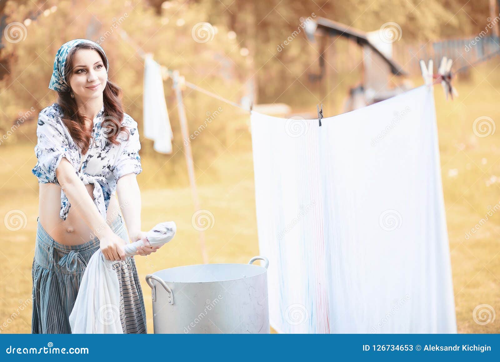 Pregnant Woman Hanging Sheets on the Rope for Drying Stock Image ...