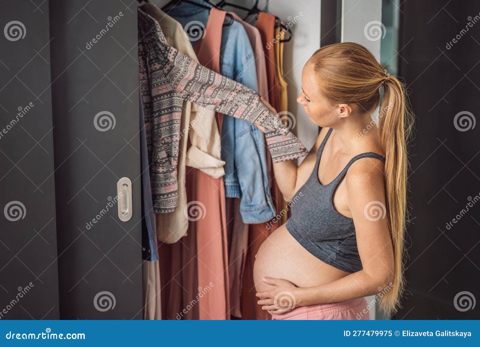 A Pregnant Woman Has Nothing To Wear. a Pregnant Woman Stands in Front of a  Closet with Clothes and Does Not Know What Stock Image - Image of clothing,  scarf: 277479975
