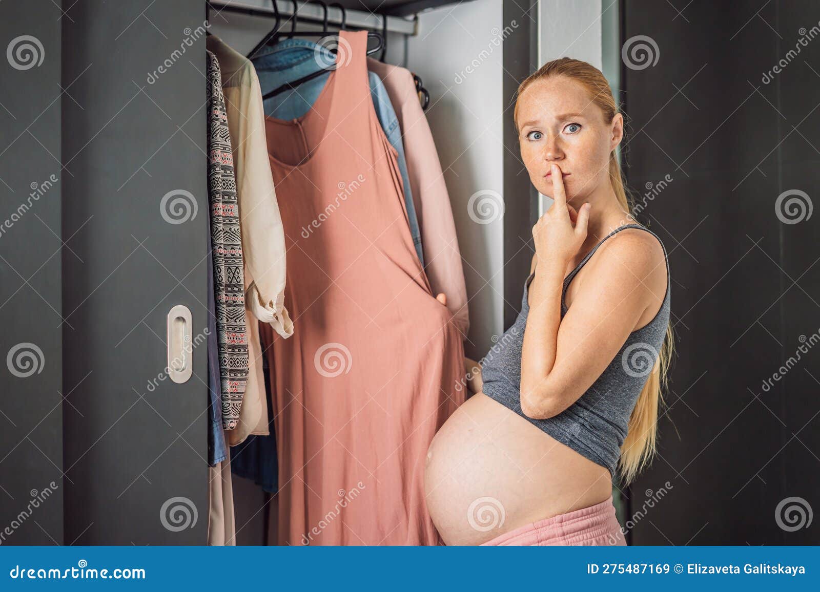 A Pregnant Woman Has Nothing To Wear. a Pregnant Woman Stands in Front of a  Closet with Clothes and Does Not Know What Stock Image - Image of finding,  fabric: 275487169