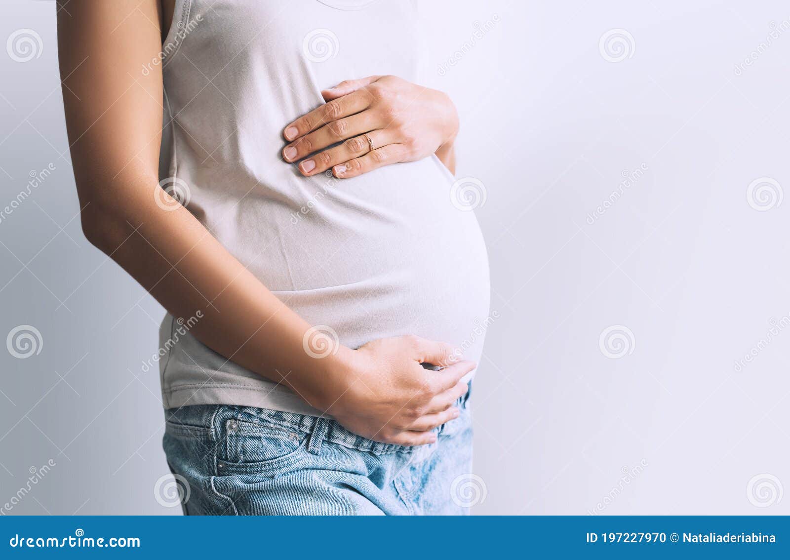 Pregnant Woman Holds Hands On Belly Photo Of Pregnancy Stock Photo