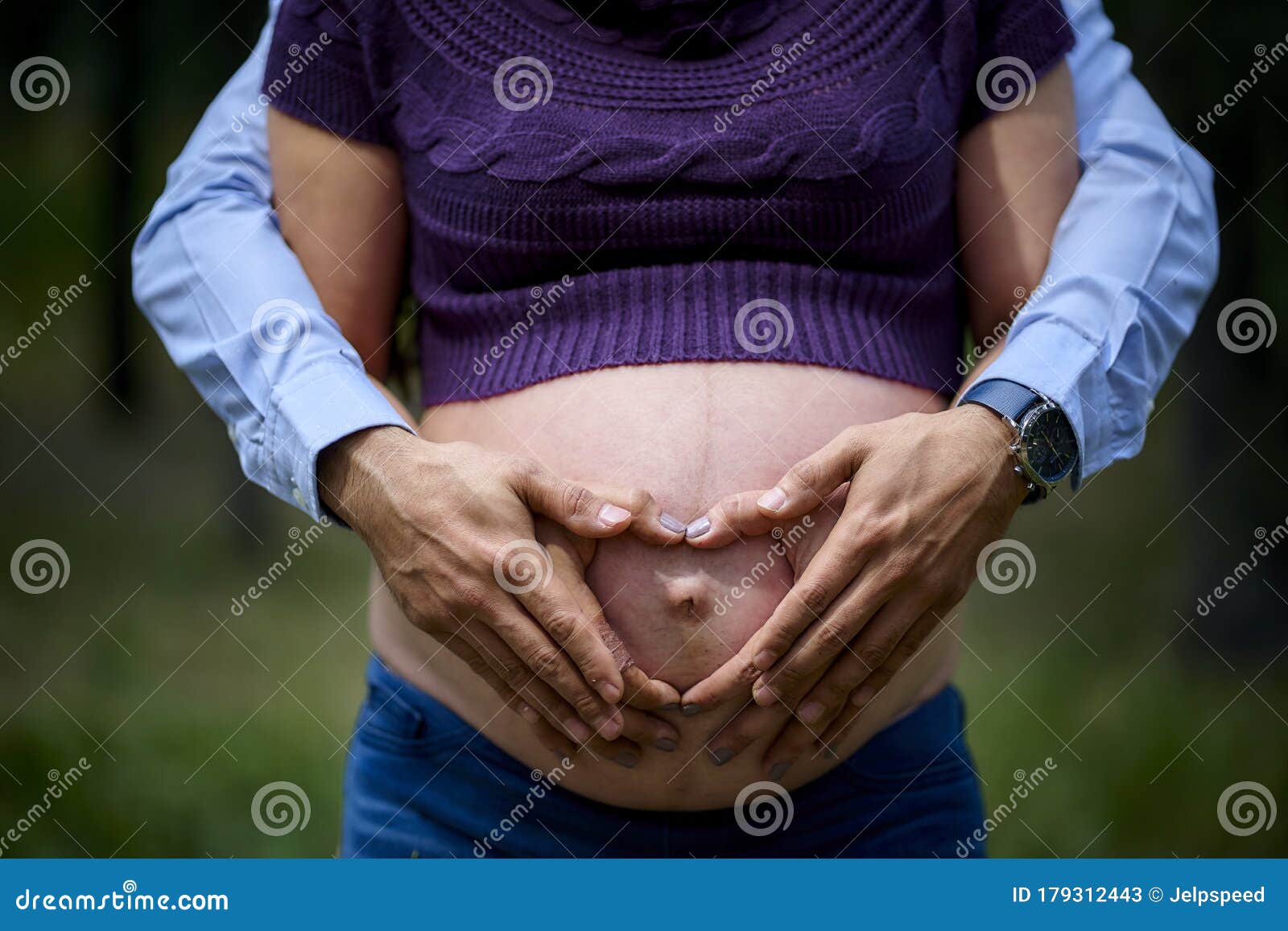 maternity pregnant woman in forest with father