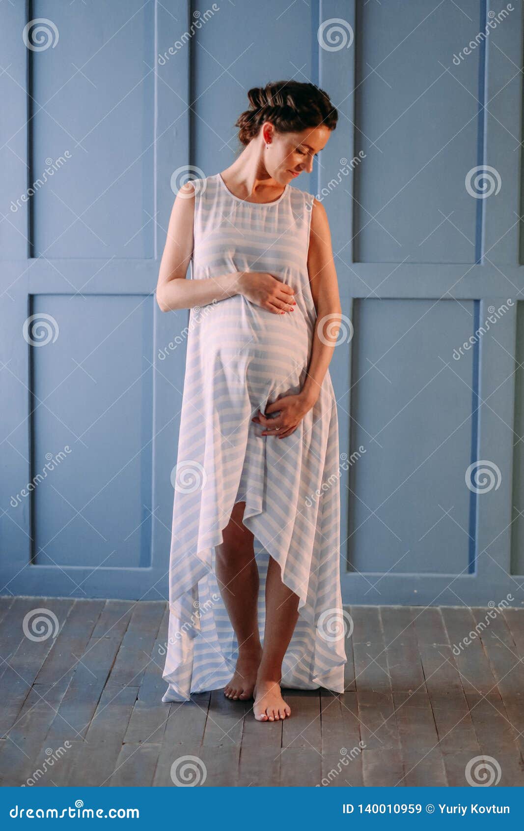 Pregnant Woman Inside Room Gently Strokes Belly Stock Image Image Of