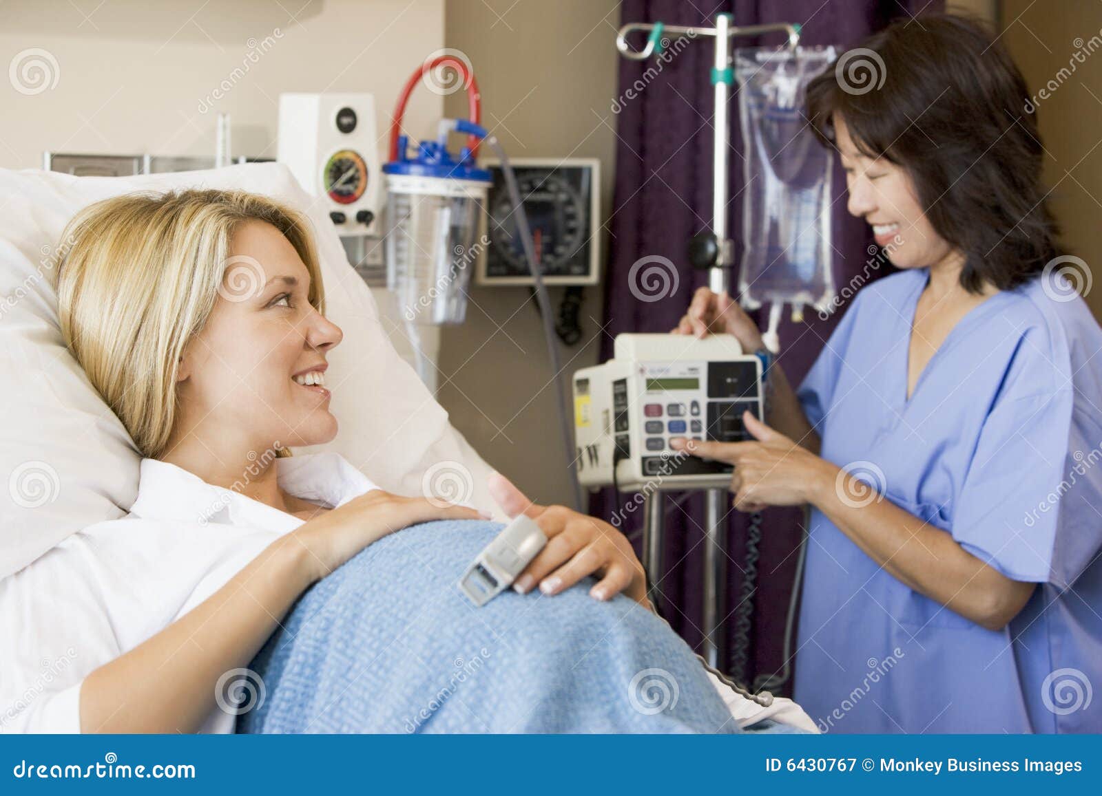 pregnant woman lying in hospital bed