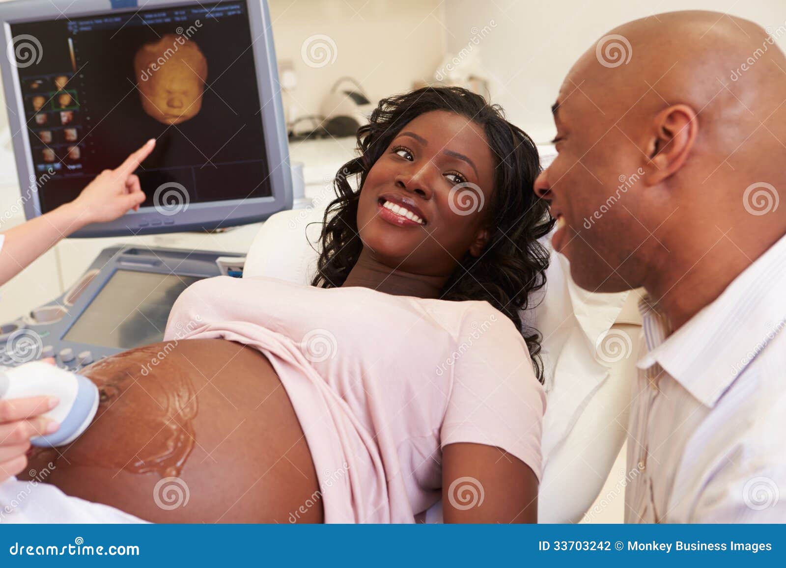 pregnant woman and partner having 4d ultrasound scan