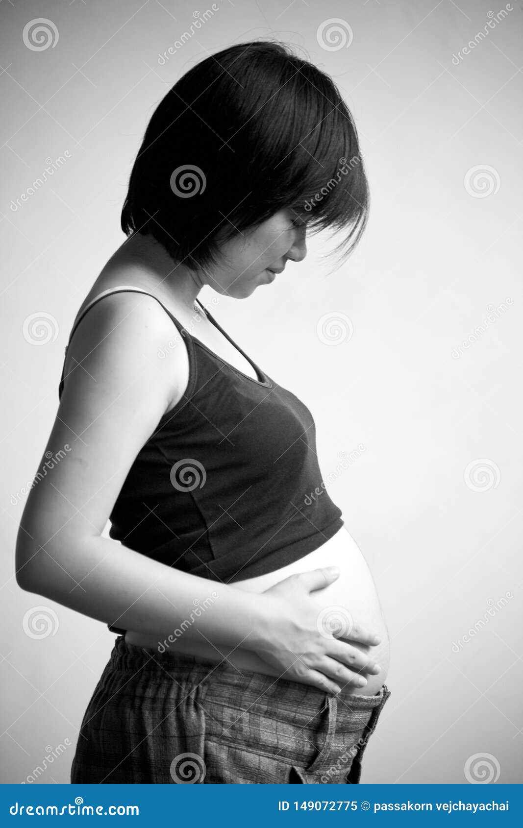 pregnant woman. Portrait of pretty young woman. Future mother, abdomen, adult, anticipation, attractive, baby, background, beautiful, beauty, belly, birth, body, care, childbirth, copyspace, cute, elegant, expectant, expecting, family, fashion, female, girl, hand, happy, health, holding, human, isolated, life, love, lovely, maternity, motherhood, parent, person, positive, pregnancy, pregnant, smile, stomach, studio, touch, tummy, waiting, white