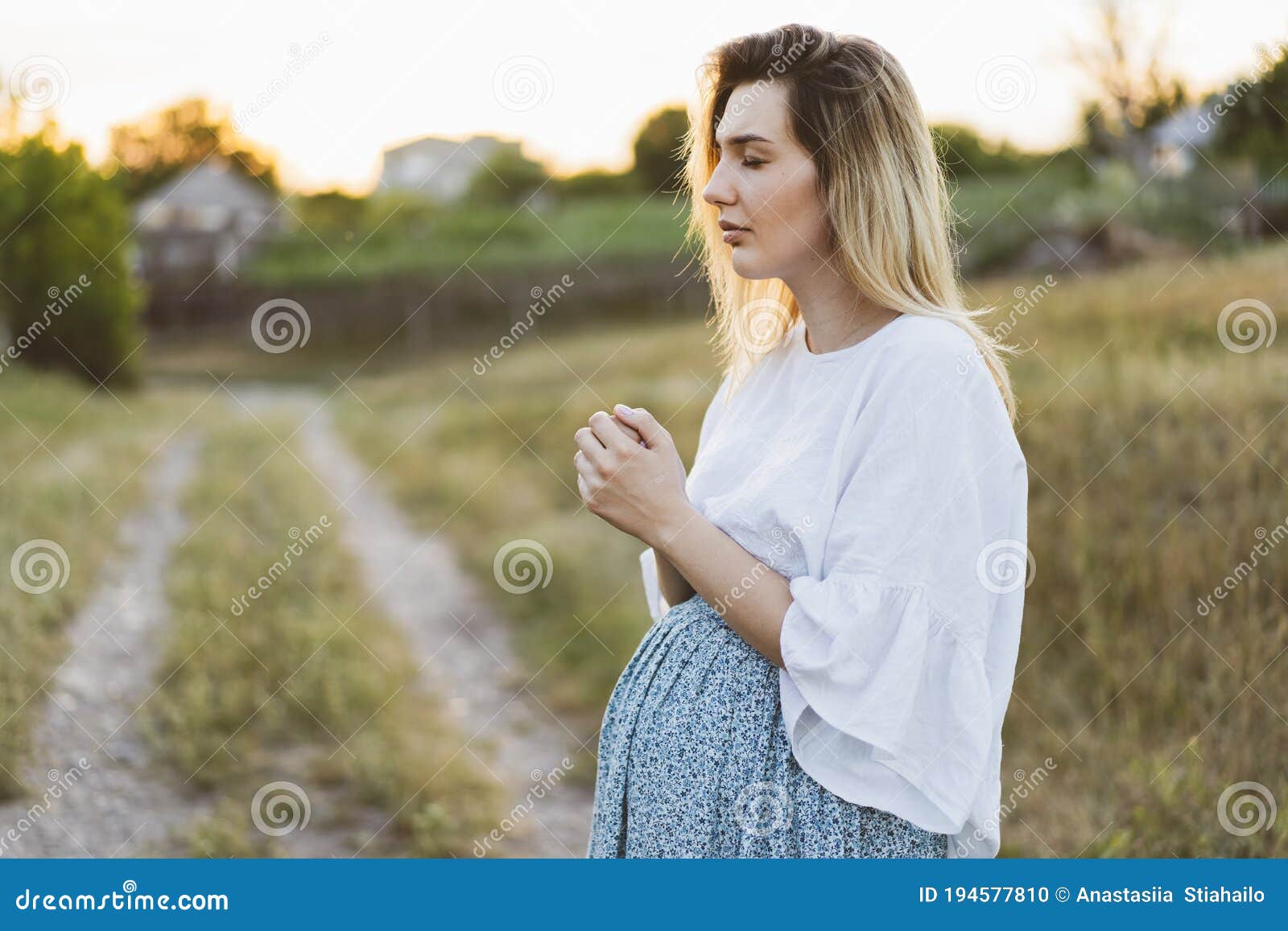 Pregnant Woman Praying Outdoors on at Sunset. Concept for Faith ...