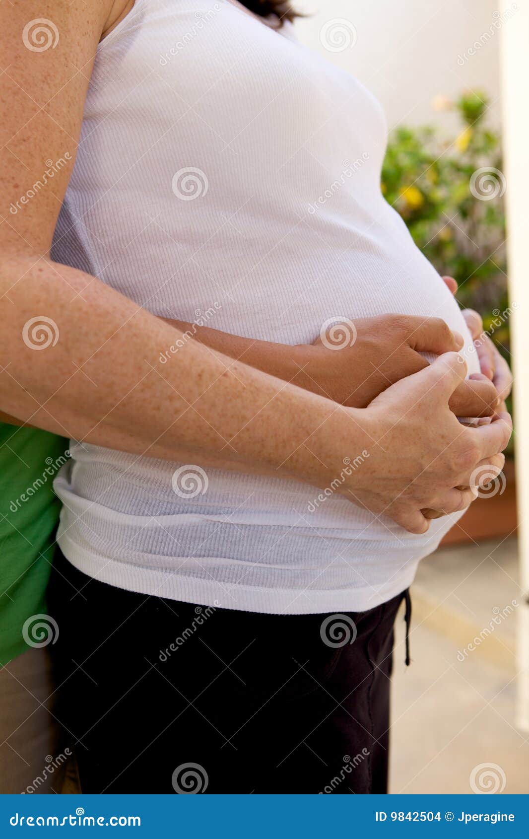 Pregnant Woman, Pregnant Couple. A Pregnant woman expecting a baby with a full belly