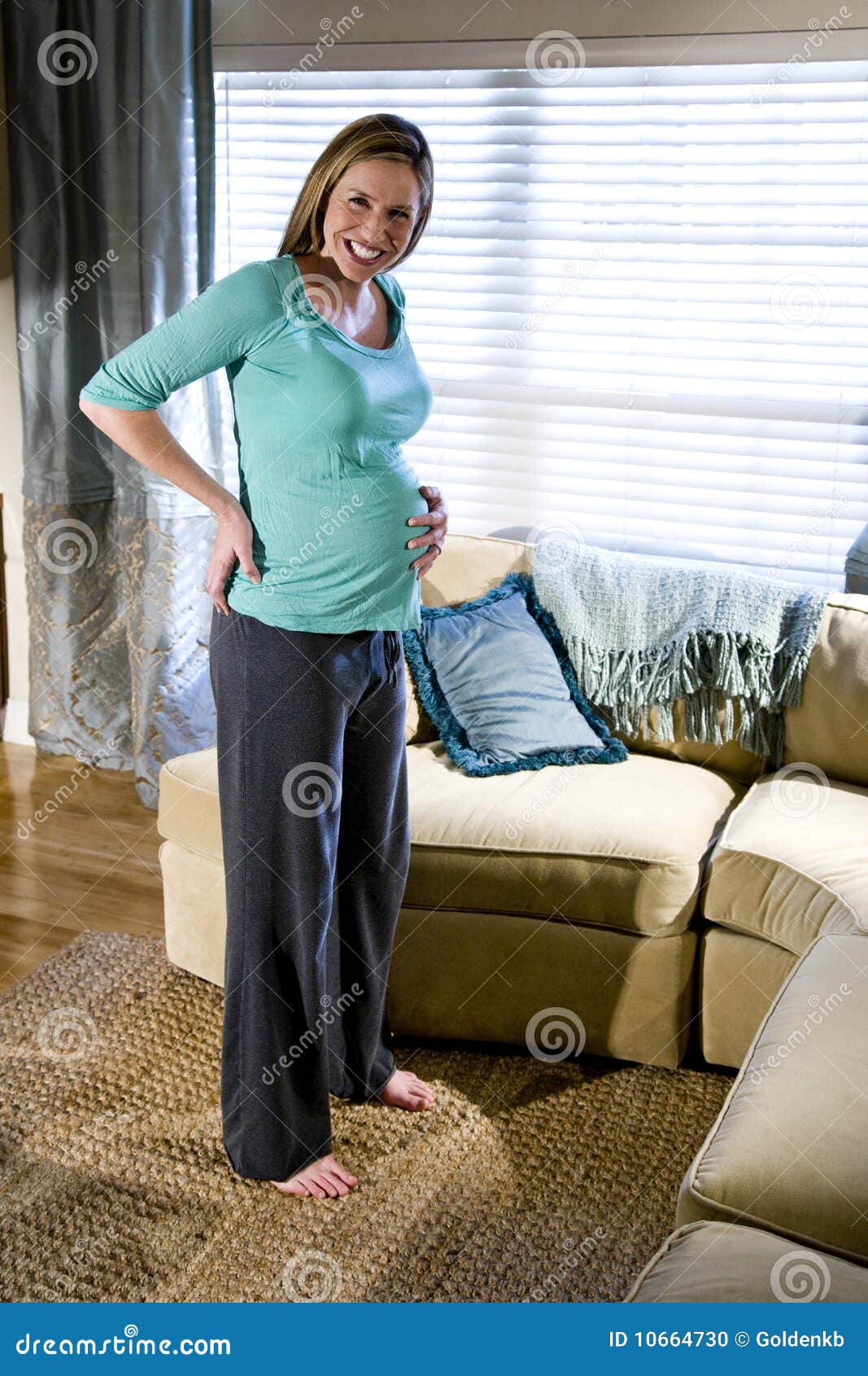 Pregnant Woman Standing In Living Room Stock Photo - Image of pregnancy
