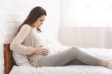 Pregnant Woman Suffering from Abdominal Pain at Home Stock Photo ...