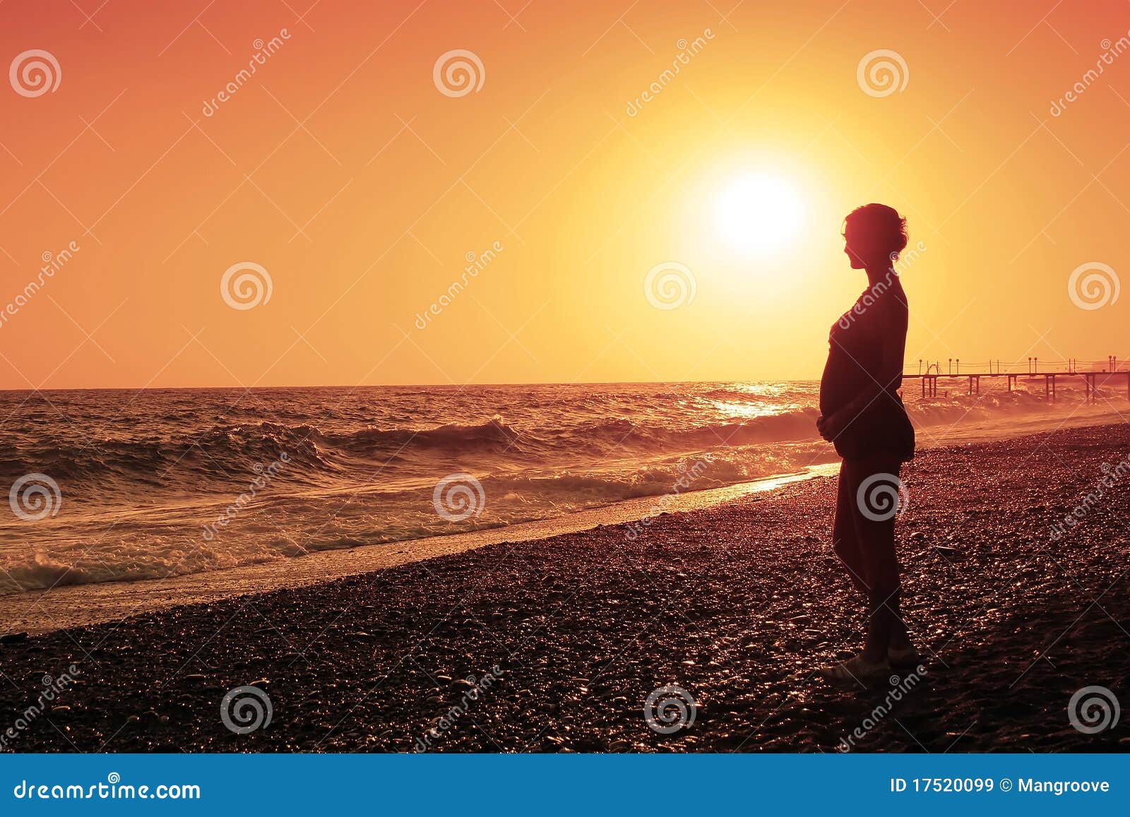 pregnant woman and sunset