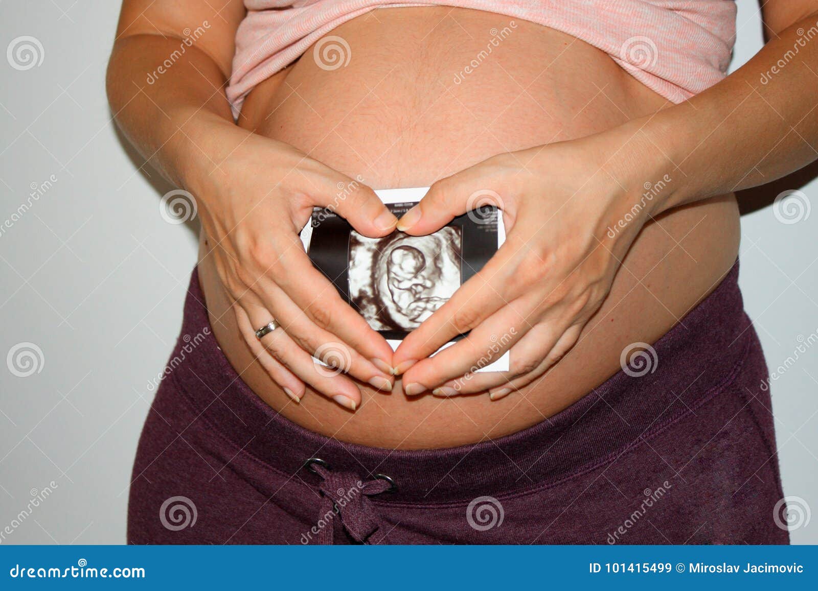 Pregnant Woman Touching Her Big Belly Close Up Stock