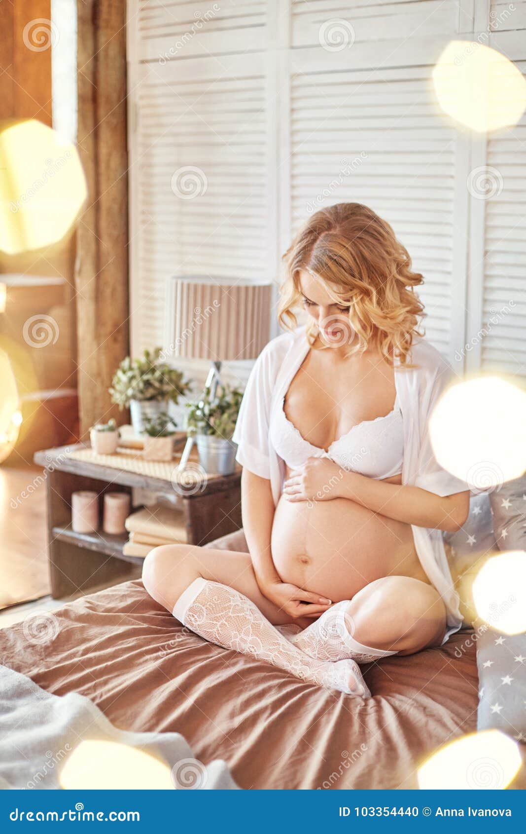 Pregnant woman in lingerie on gray background. A few days before birth.  Beautiful pregnant blonde woman waiting for the birth of the child.  Expectant mother Stock Photo by ©angel_nt 149747484