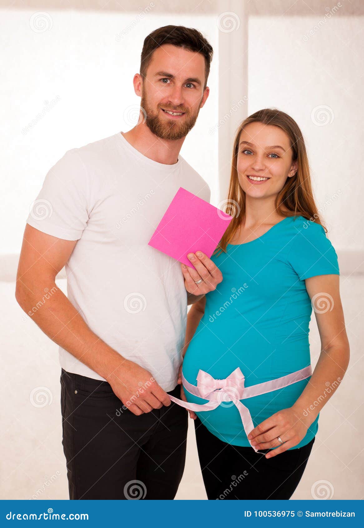 pregnant woman and her man - studo photography of a young couple