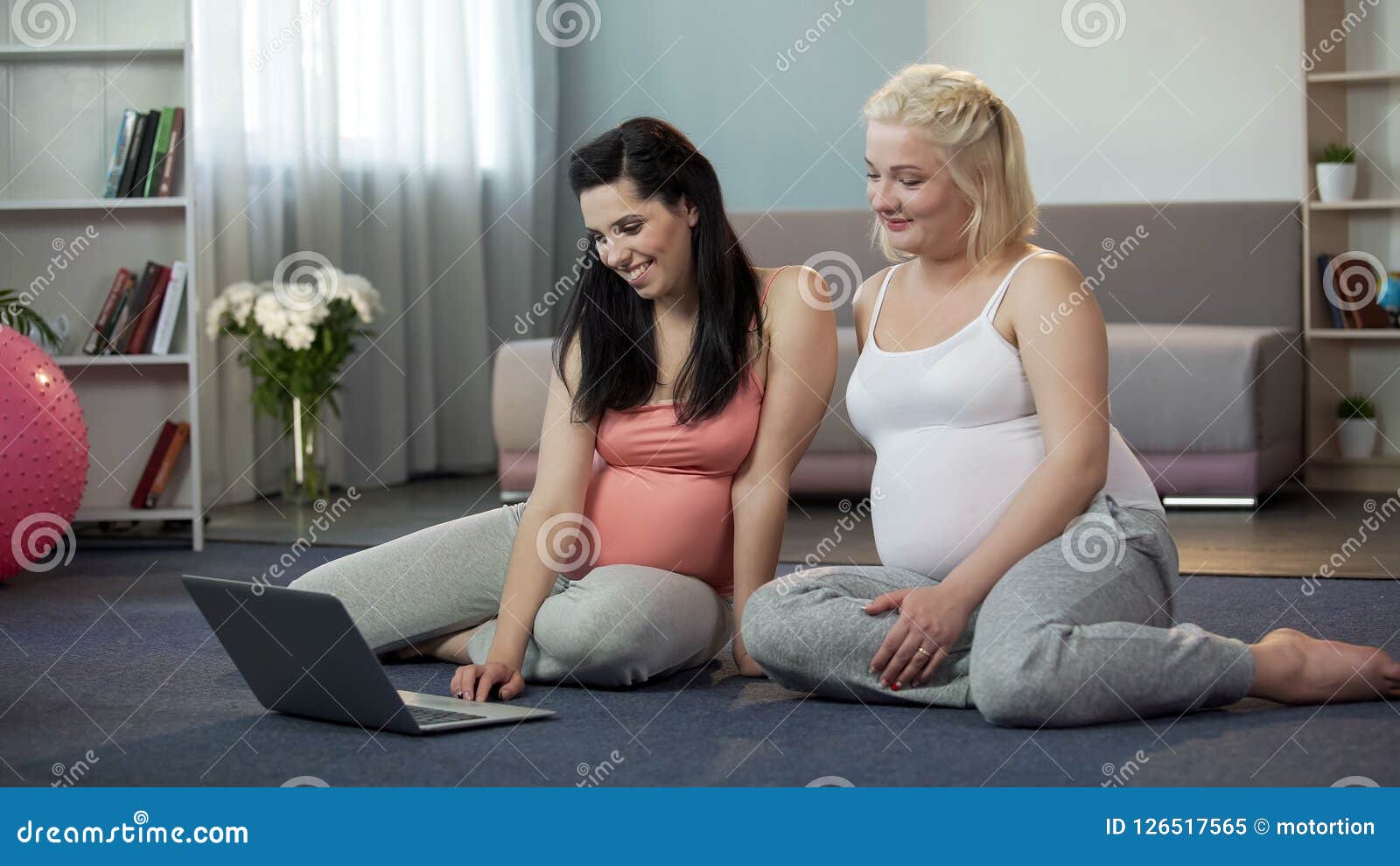 pregnant women viewing websites on laptop, online shopping for future moms