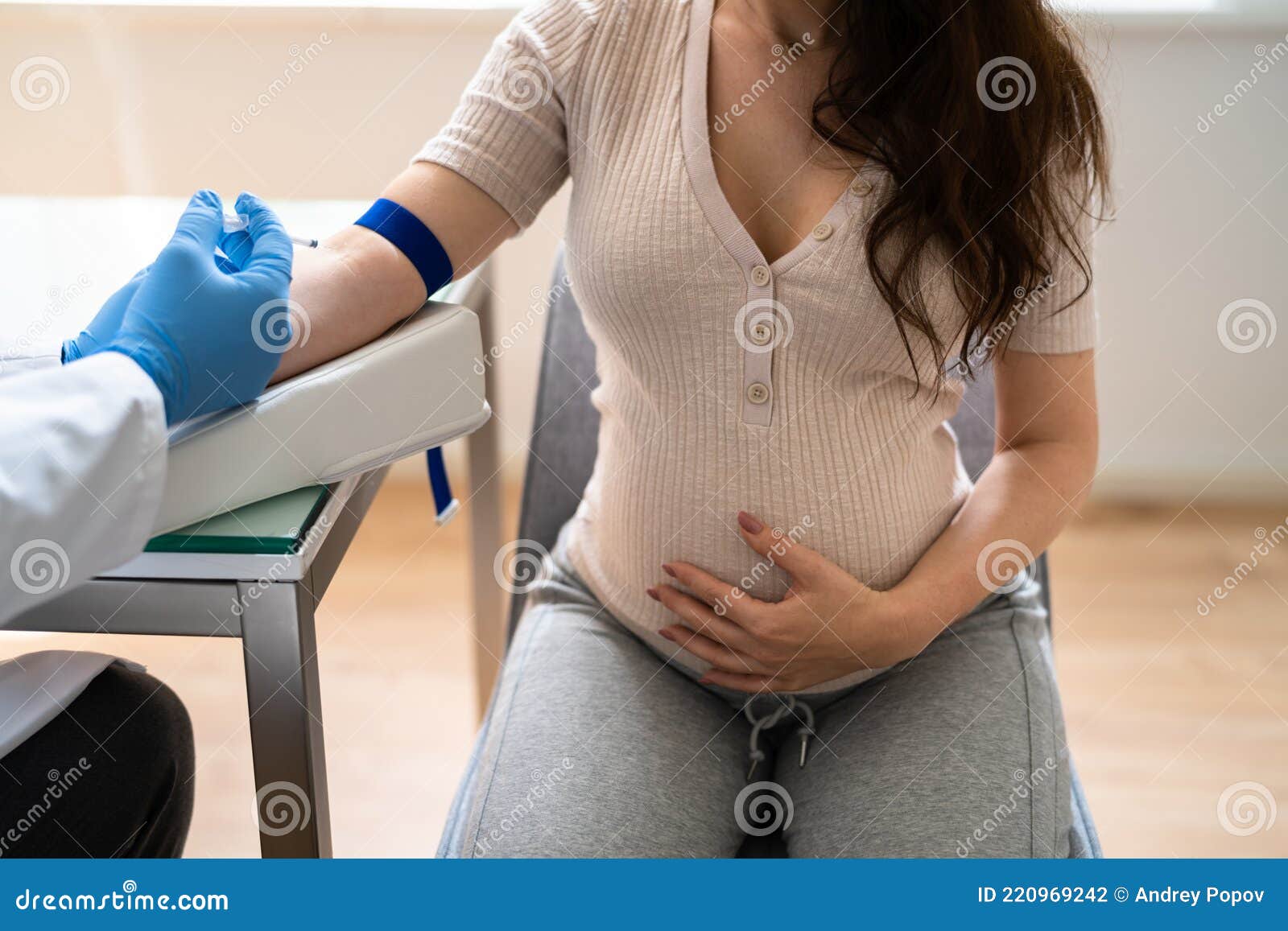 prenatal screening. doctor drawing blood sample