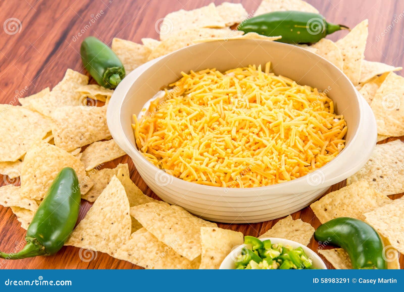 Preparation of Bean Dip with Jalapenos, Sour Cream and Cheddar C Stock