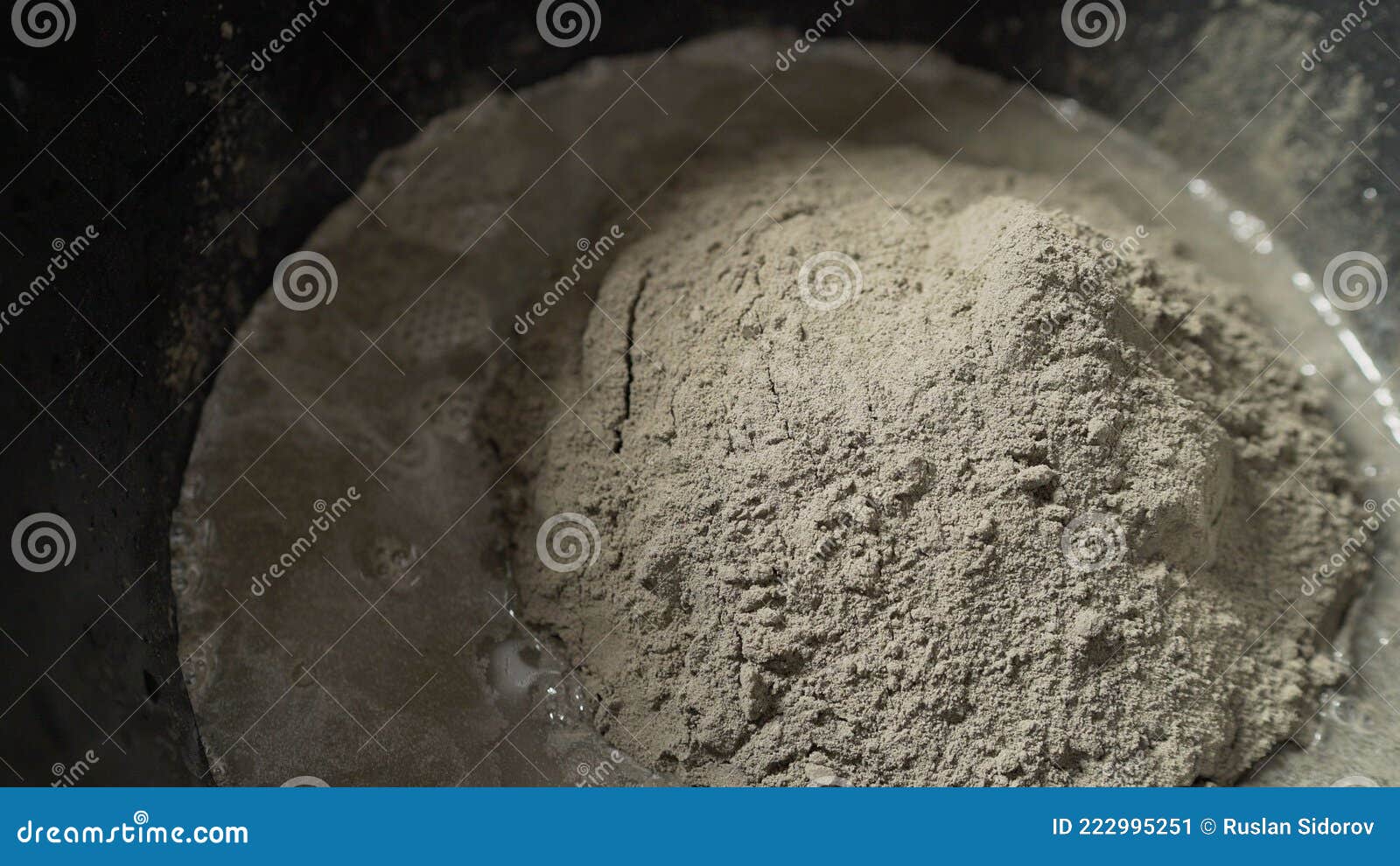 Preparation of Cement Mix for Use in Tile Laying. a Closeup of a Solution in a Bucket. Stock