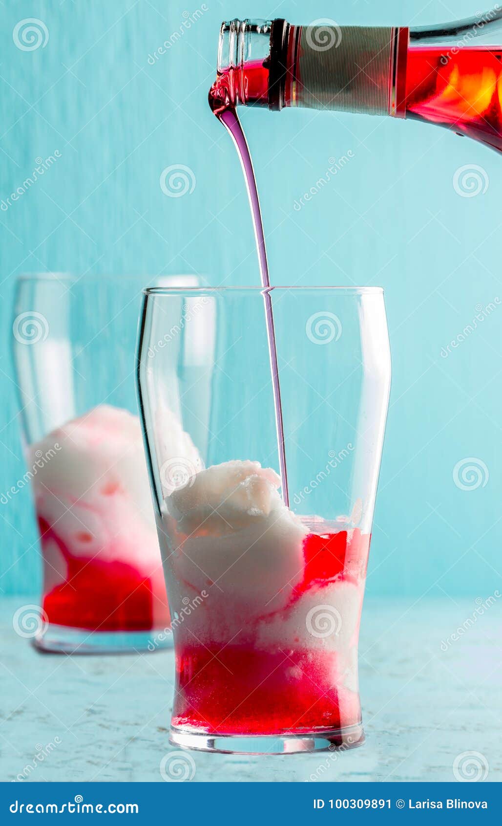 preparation of cocktail terremoto. chilean traditional alcoholic drink terrremoto. with pineapple ice cream, liquor