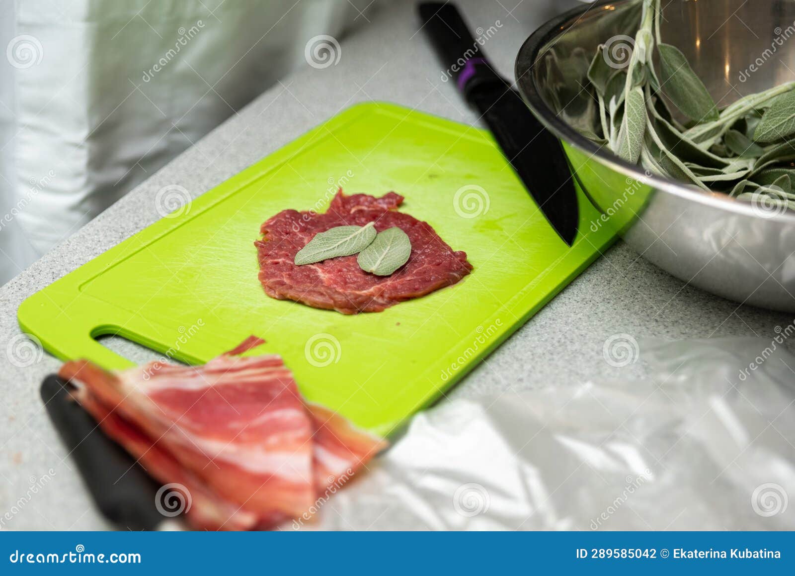 Preparation Laying a Bay Leaf in the Beaten Beef Meat on a Cutting