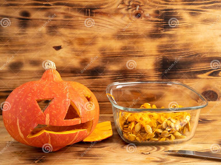 prepare-pumpkin-for-halloween-carve-out-the-pumpkin-s-face-stock-photo