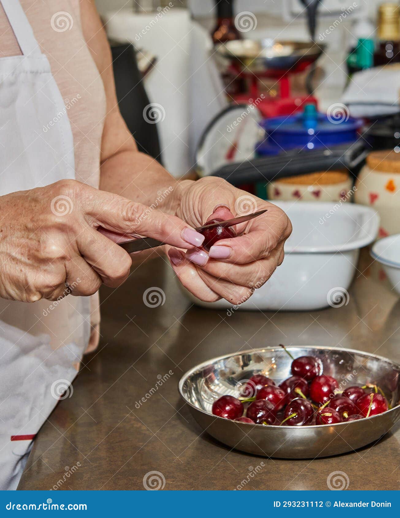 Prepares Cherries, Pits Cherries To Make Cherry Pie Stock Photo Image