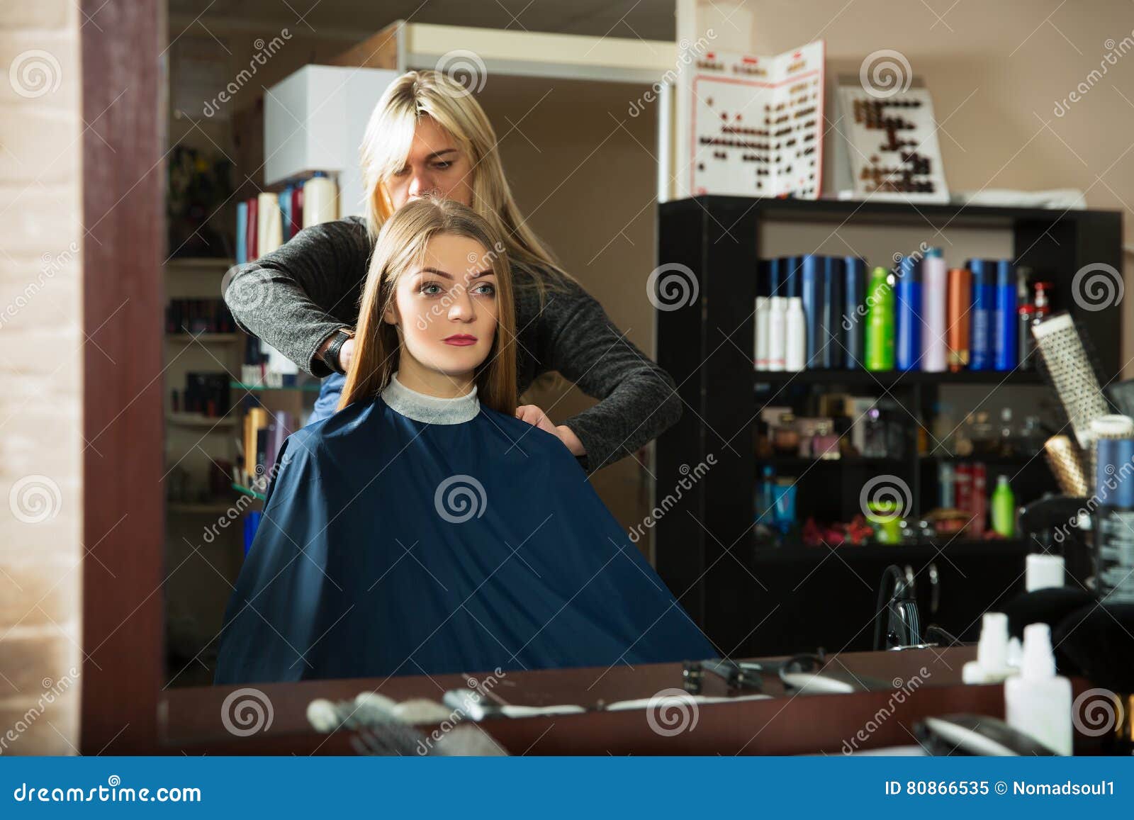 Prepares for Hairdressing in Front of the Mirror. Stock Image Image