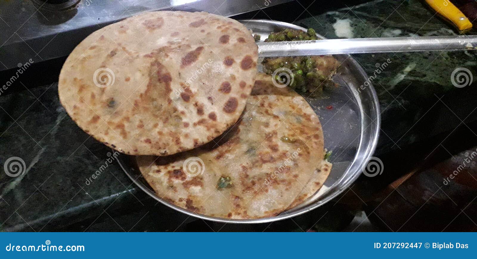 Preparing Aloo Paratha Frying with Ghee Very Popular in North India