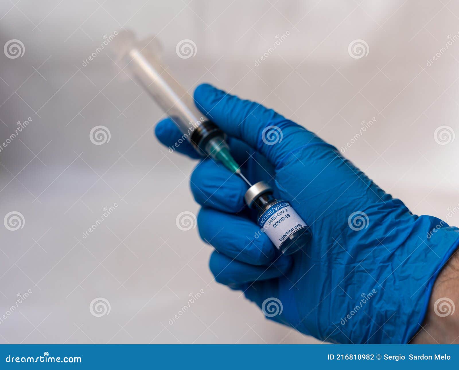 preparing covid-19 vaccine for injection