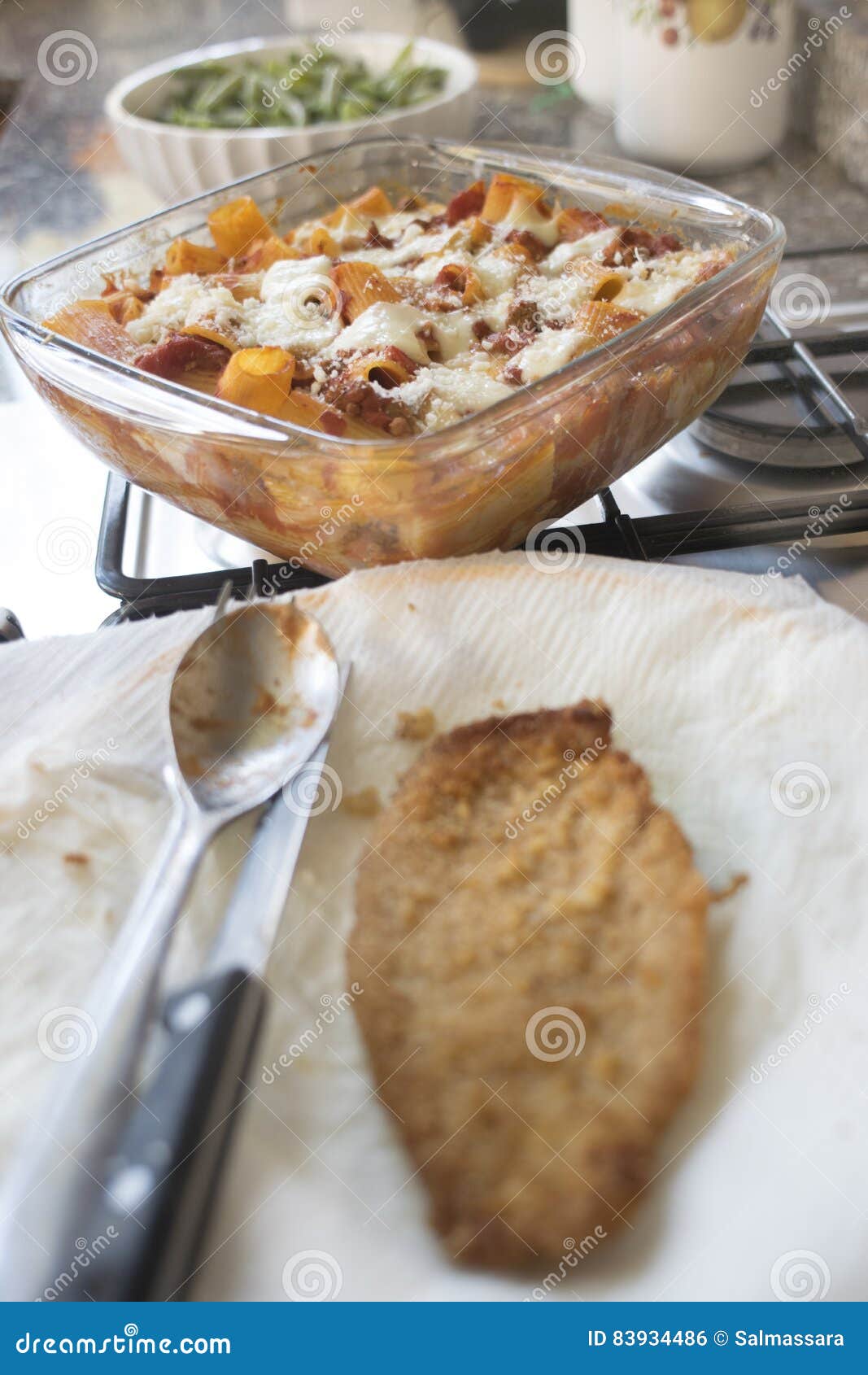 Preparing Dinner with Lasagna and Cutlet Stock Photo Image of food