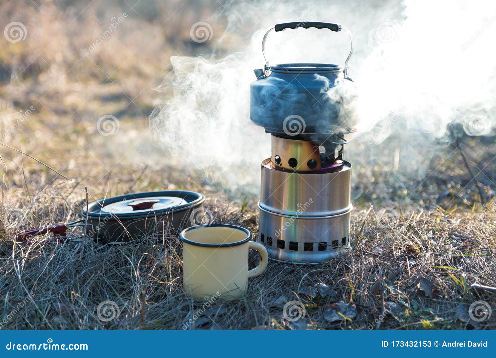 Preparing Food and Hot Drinks on Campfire in Wild Camping Stock Image