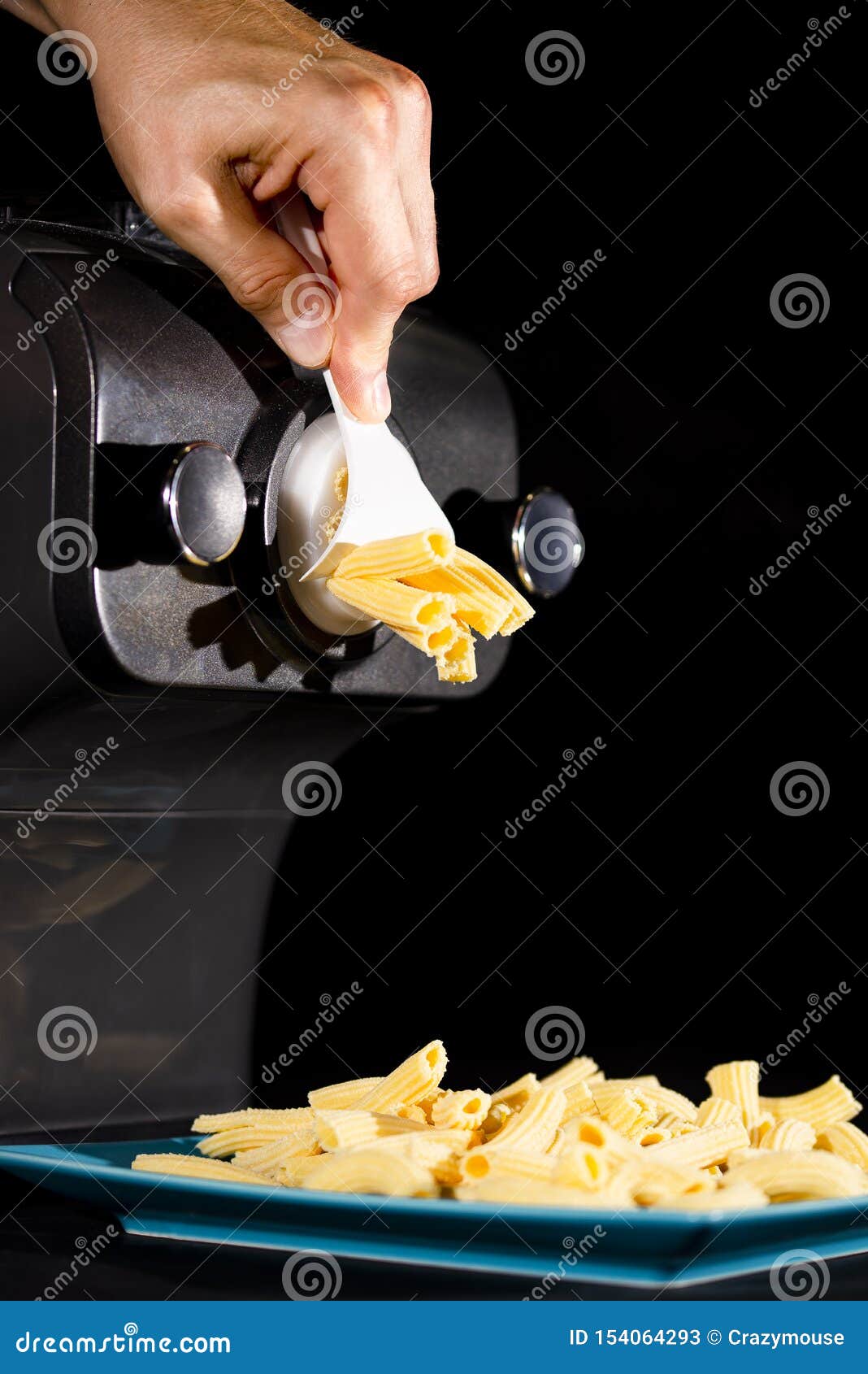 Home Made Pasta by Pasta Maker. an Indifinited Man Cutting the Rigatoni  Stock Image - Image of dinnertime, uncooked: 154064293