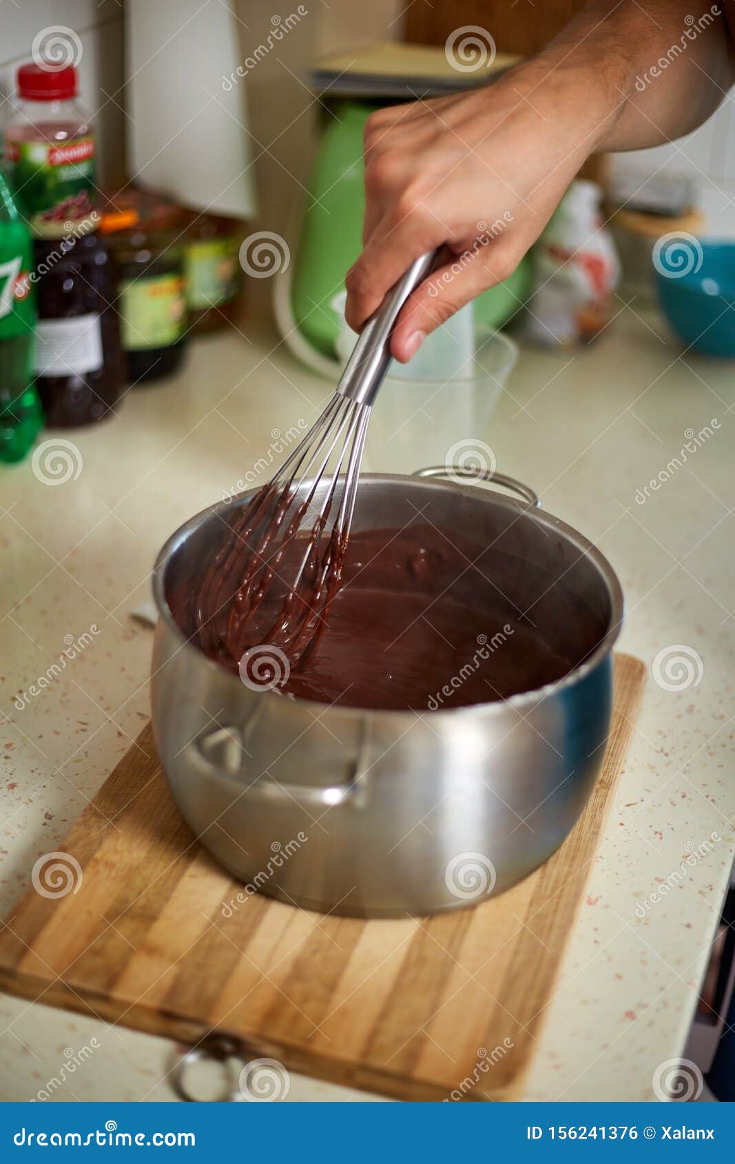 Preparing Homemade Chocolate Pudding, Closeup on Hands Stock Photo